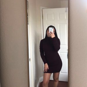 Dark purple, turtle neck, dress.